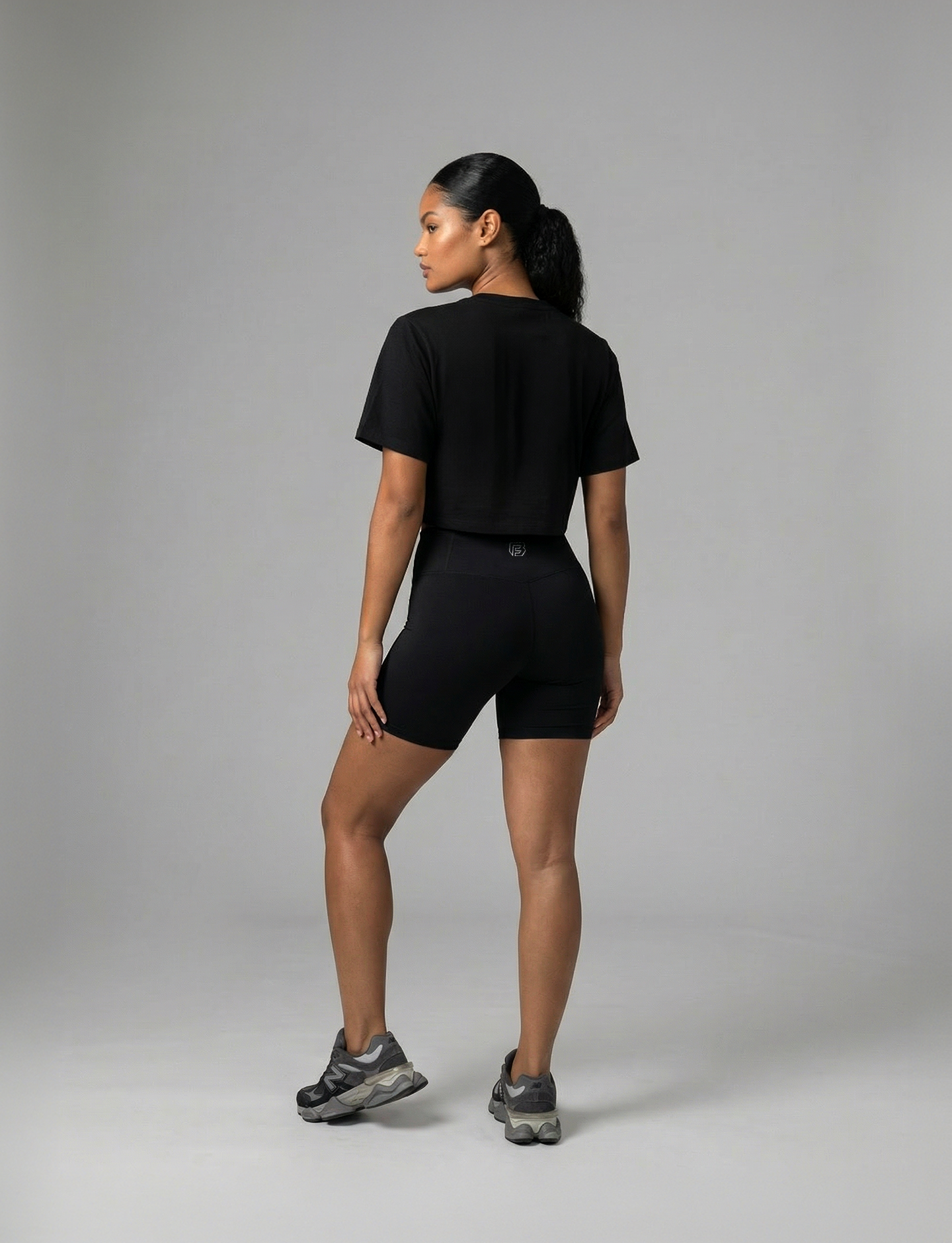 Always at the Gym women's cropped gym tee in black back view on Fitness model #color_black